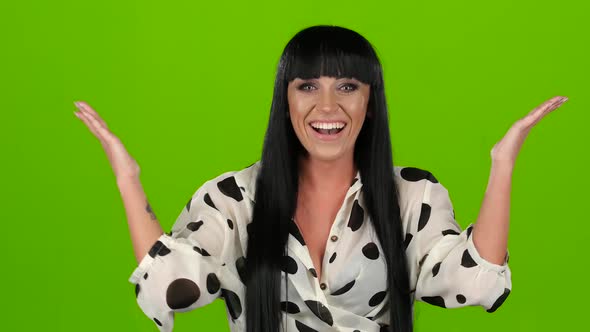 Woman Poses for the Camera and Laughing, Green Screen Background