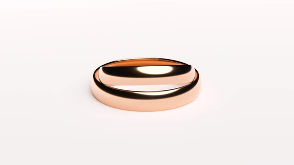 Wedding Golden Rings Lie on White Rotating Background Surface