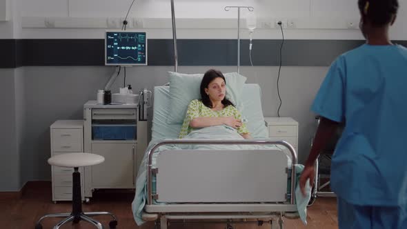 Specialist Doctor Monitoring Sick Woman Examining Pulse Oximeter