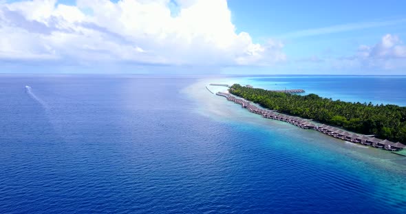 Luxury overhead tourism shot of a sunshine white sandy paradise beach and blue sea background in hig