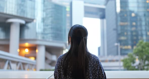 Woman look around in city, business corporate tower background