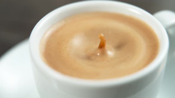 Drop Falling Into a Cup of Coffee in Super Slowmotion.