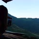 Blurred of a woman using mobile phone to take photo of a beautiful mountain view - VideoHive Item for Sale