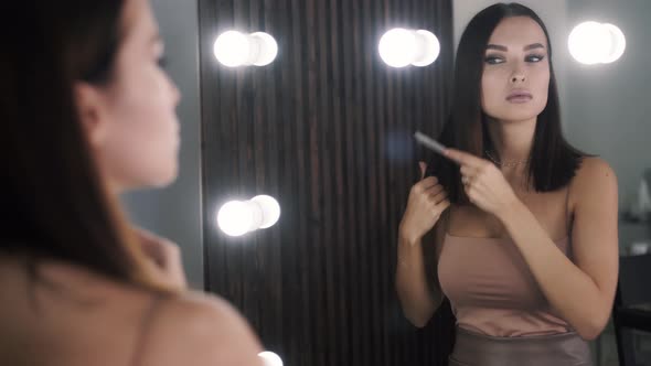 Cute Caucasian Attractive Woman Model Combing Hair in Her Room