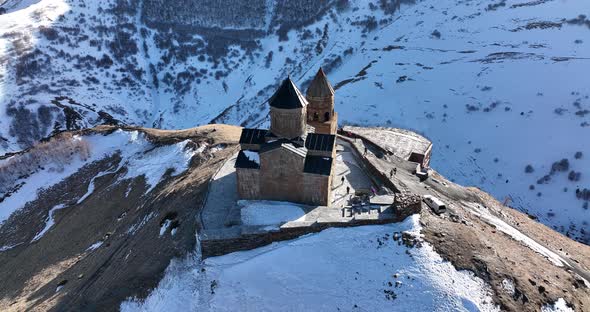 Aerial view of Gergeti Trinity Church, Tsminda Sameba in Kazbegi. Georgia 2022