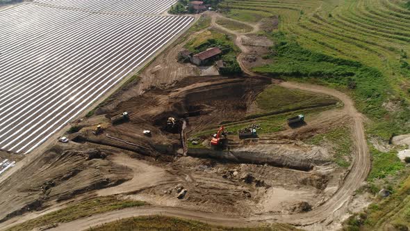 Industrial Machines, Trucks and Excavators Working on Farm