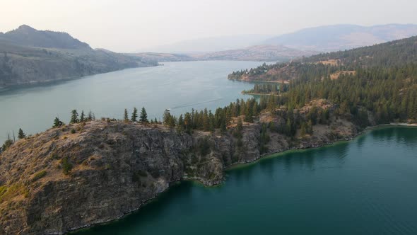 4k drone fly over of rattlesnake point at Kalamalka lake in British Columbia, Canada. Summer sunset