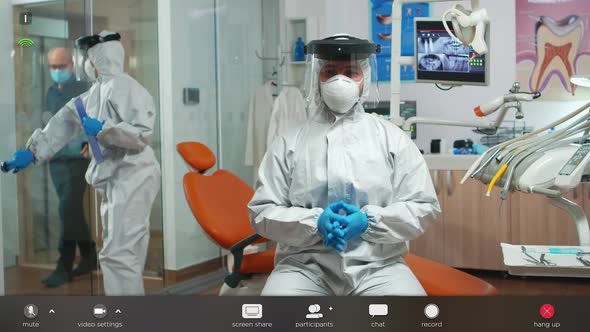 Dentistry Doctor Wearing Ppe Suit Speaking at Camera