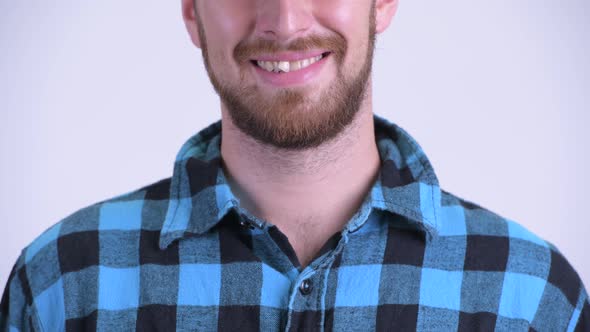 Smile of Bearded Hipster Man Against White Background