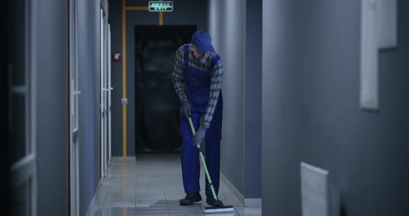 Janitor Cleaning a Corridor When Fire Breaks Out