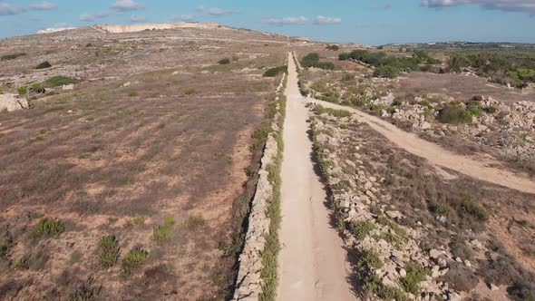 Aerial drone video from northern Malta near the Ghajn Znuber Tower.