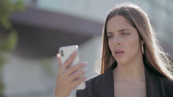 Shocked Girl Reading Message Via Smartphone