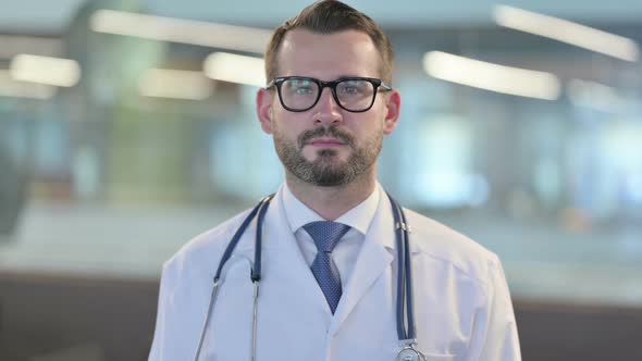 Portrait of Young Male Doctor Looking at Camera