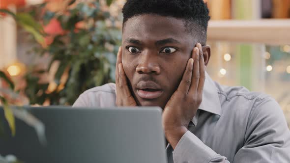 Closeup Young Male Businessman Looking at Laptop Screen Receiving Email Reading Shocking Bad News