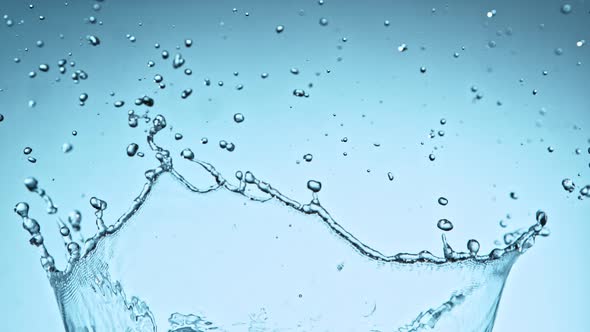 Super Slow Motion Shot of Water Splash at 1000Fps on Blue Gradient Background