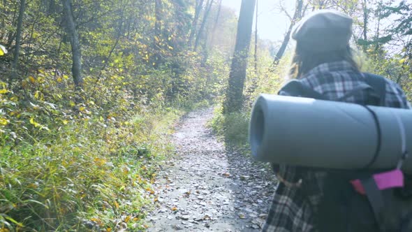 Girl on a Hike in the Mountains. Slow Motion Video