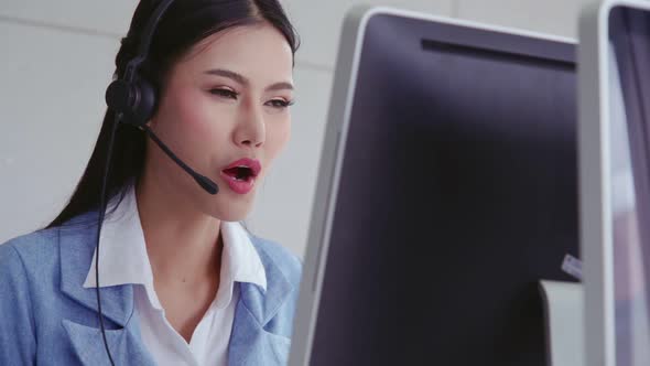 Customer Support Agent or Call Center with Headset Talking to Customer on Phone