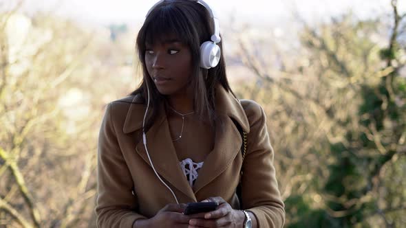 Portrait of young woman listening to music