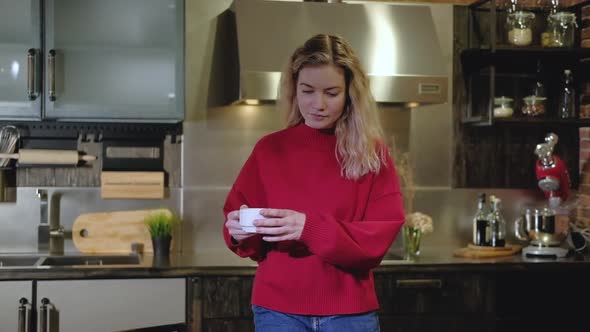 Freelancer woman mug coffee comes to table with laptop, opens it starts working