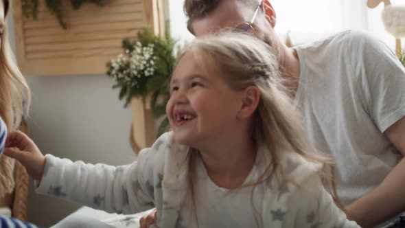 Family spending Christmas morning together in bed. Shot with RED helium camera in 8K