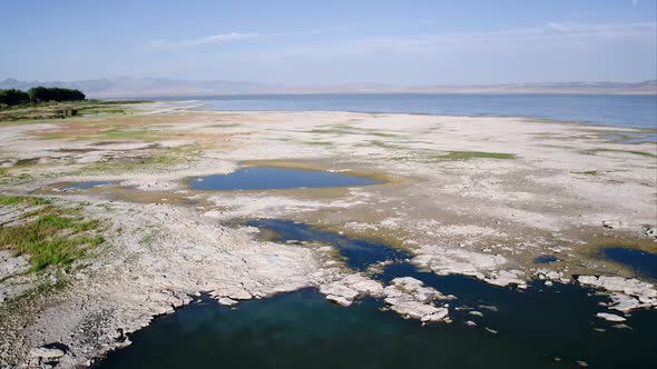 Views of rocky shoreline while flying