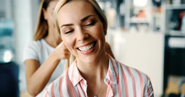 Portrait of Beautiful Young Woman Getting Haircut