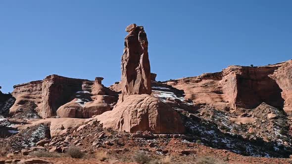 Driving past Sheep Rock in Arches National Park during the day