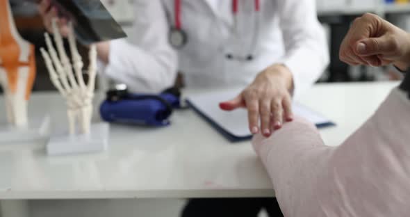 Patient with Broken Arm Visits Traumatologist and Examines Xray