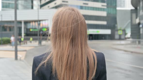 Close Up of Young Businesswoman Walking on the Street Back View