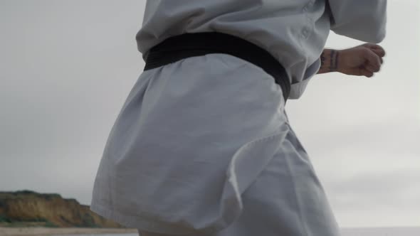 Karate Fighter Training Martial Skills on Seacoast