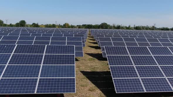 High Angle View of a Solar Power Station with Many Rows of Solar Panels