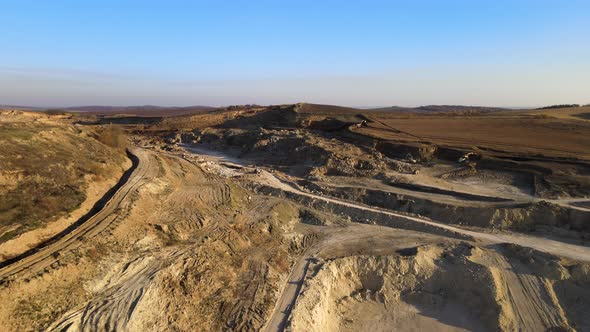 Aerial View of Open Pit Mining Site of Limestone Materials for Construction Industry with Excavators