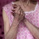 Close up of senior woman rubbing hands - VideoHive Item for Sale