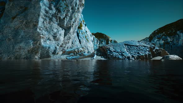 Rocky Cliff at Cold Sea Water