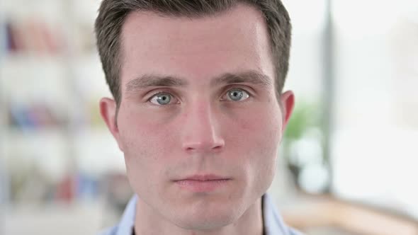 Close Up of Serious Young Man Face