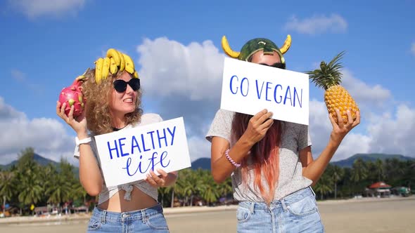 Girls Dancing on Beach With Tropical Fruits And Healthy Lifestyle Slogan