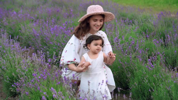 Mother Dancing with Child in Lavender Field