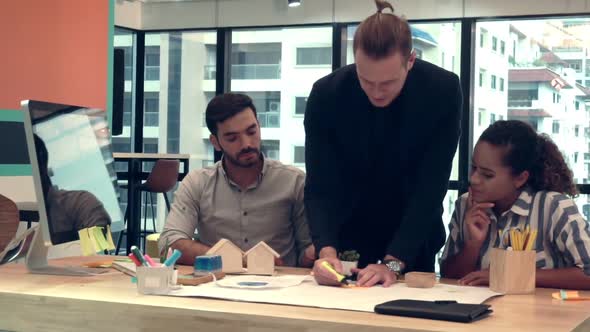 Creative Business People Group Having Conversation at Office Desk in Workplace