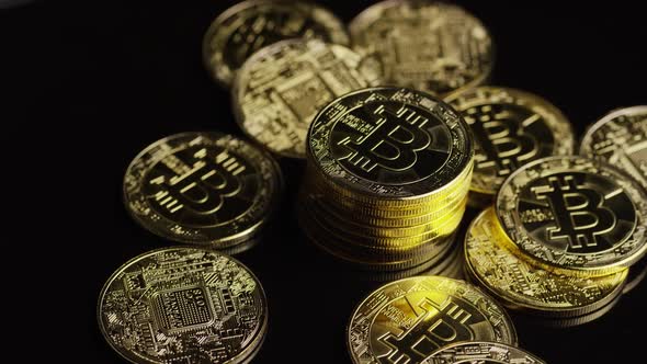 Rotating shot of Bitcoins (digital cryptocurrency) - BITCOIN 0616