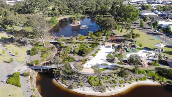 Aerial View of a Suburb with Lake and Park