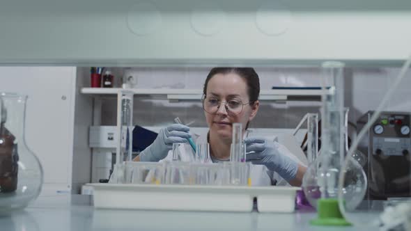 Female Chemist Doing Research in Lab