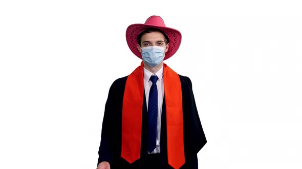 Male Graduating Student In Cowboy Hat Walking And Showing Diploma