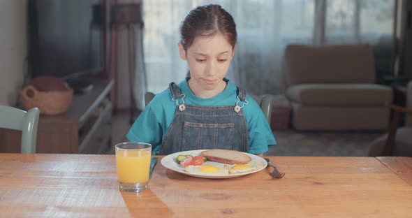 Child nutrition - girl refusing to eat healthy food