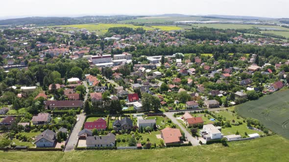 Aerial Drone Shot  Colorful Houses in a Beautiful Town in a Rural Area  Drone Turns to the Left
