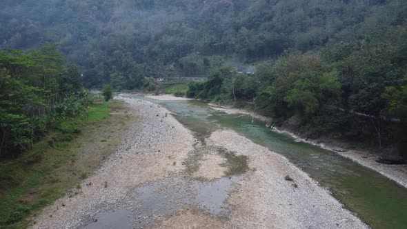 Beautiful view of a river in the middle of the mountains in the morning