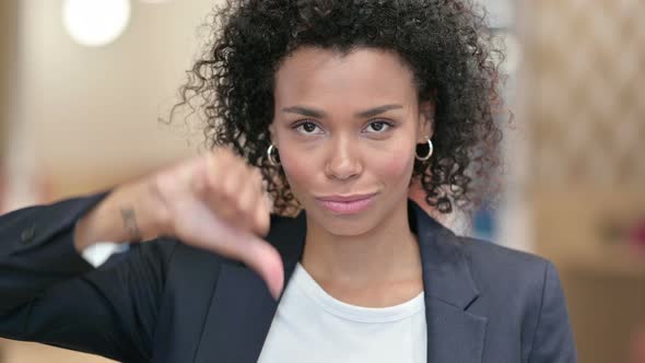 Disappointed African Businesswoman Doing Thumbs Down 