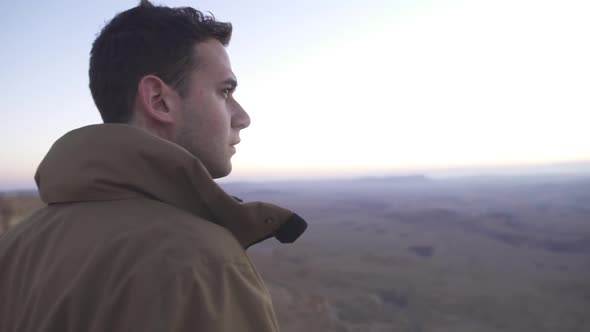 Traveler looking at the desert view during sunrise