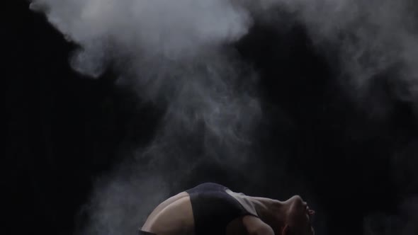 Close-up Slow Motion, Virtuoso Dancer Throwing Dust Particles in Air.