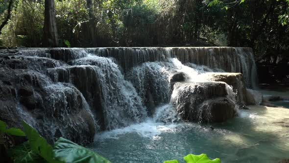 Slowmotion Dolly In of Beautiful Kuang Si Waterfall with Heavy Water