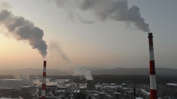 Aerial View on Power Plant Pipe with White Smoke in Winter